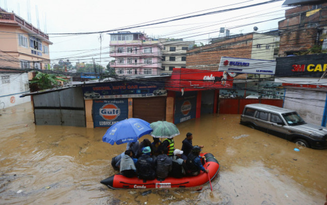 kathmandu-nepal-28th-sep-2024-security-force-members-use-an-inflatable-raft-to-bring-residents-to-safety-from-a-flooded-area-near-the-bank-of-the-overflowing-bagmati-river-following-heavy-rains-i