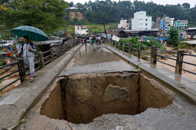 a-bridge-over-bagmati-river-lies-damaged-due-to-floods-caused-by-heavy-rains-in-kathmandu-nepal-saturday-sept-28-2024-ap-photogopen-rai