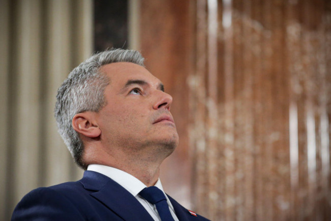 austrian-chancellor-karl-nehammer-looks-up-while-attending-a-debate-at-the-national-broadcaster-studio-set-up-in-the-parliament-building-in-vienna-austria-sunday-sept-29-2024-after-polls-close