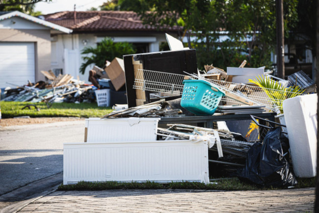 st-petersburg-florida-usa-29th-sep-2024-residents-of-the-riviera-bay-neighborhood-empty-the-water-damaged-contents-of-the-homes-that-were-destroyed-due-to-the-record-high-storm-surge-caused-by-h