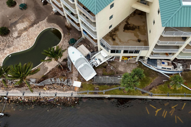 boats-sit-after-being-pushed-ashore-by-floodwaters-from-hurricane-helene-on-saturday-sept-28-2024-in-st-petersburg-fla-ap-photomike-carlson