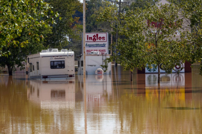 a-couple-of-rvs-are-abandoned-in-the-flooded-ingles-parking-lot-due-to-the-torrential-rains-from-hurricane-helene-saturday-sept-28-2024-in-morganton-n-c-ap-photokathy-kmonicek