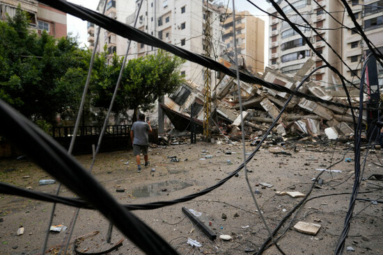 a-man-checks-the-damaged-buildings-at-the-site-of-an-israeli-airstrike-in-beiruts-southern-suburb-lebanon-tuesday-oct-1-2024-ap-photohassan-ammar