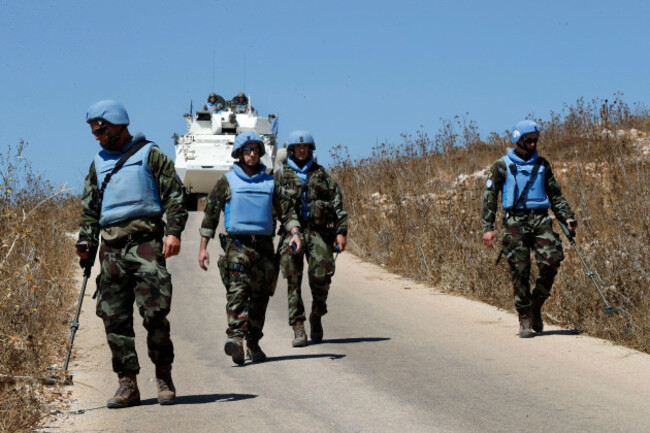 irish-un-peacekeepers-use-mine-detectors-as-they-patrol-near-the-fields-struck-by-israeli-army-shells-in-the-southern-lebanese-israeli-border-village-of-maroun-el-ras-lebanon-monday-sept-2-2019