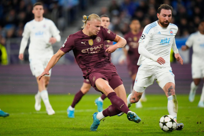 manchester-citys-erling-haaland-takes-a-shot-during-the-champions-league-opening-phase-soccer-match-between-slovan-bratislava-and-manchester-city-in-bratislava-slovakia-tuesday-oct-1-2024-ap-p