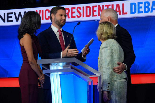 republican-vice-presidential-nominee-sen-jd-vance-r-ohio-and-his-wife-usha-vance-talk-with-democratic-vice-presidential-candidate-minnesota-gov-tim-walz-and-his-wife-gwen-walz-after-the-vice-presi