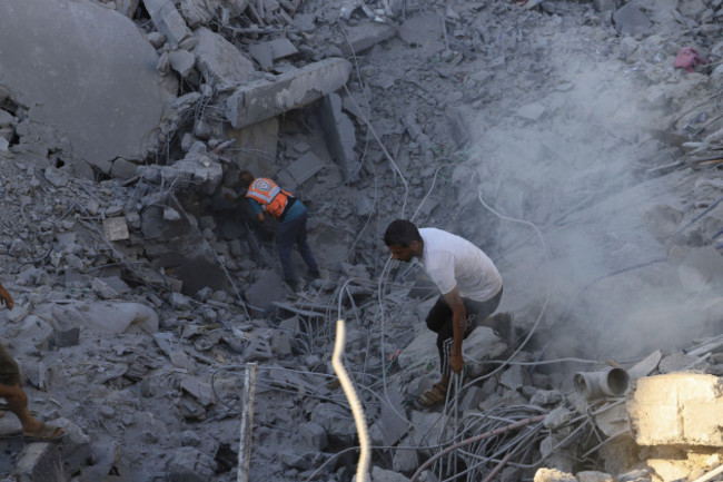 palestinians-search-for-bodies-and-survivors-in-the-rubble-of-a-residential-building-destroyed-in-an-israeli-airstrike-in-khan-younis-gaza-strip-wednesday-july-3-2024-ap-photo-jehad-alshrafi