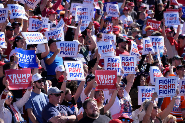 attendees-hold-up-signs-before-republican-presidential-nominee-former-president-donald-trump-arrives-to-speak-at-a-campaign-event-at-the-butler-farm-show-saturday-oct-5-2024-in-butler-pa-ap-ph