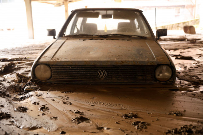 a-car-is-submerged-in-mud-following-a-flooding-in-buturovic-polje-bosnia-sunday-oct-6-2024-ap-photoarmin-durgut