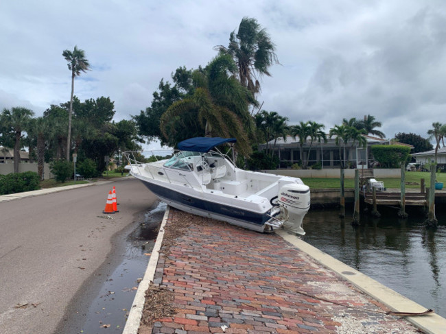 florida-usa-7th-oct-2024-a-boat-washed-up-from-hurricane-helene-two-weeks-ago-is-still-on-the-side-of-the-road-in-the-venetian-isles-neighborhood-of-st-petersburg-on-monday-oct-7-2024-credit