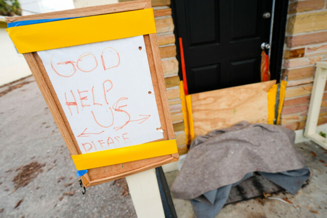 a-message-is-seen-outside-of-an-apartment-in-the-davis-islands-community-of-tampa-fla-as-residents-prepare-for-the-arrival-of-hurricane-milton-tuesday-oct-8-2024-ap-photojulio-cortez