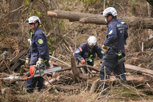 asheville-united-states-04th-oct-2024-fema-urban-search-and-rescue-teams-with-new-jersey-task-force-1-use-chain-saws-to-clear-debris-in-the-search-for-victims-and-survivors-from-flooding-caused-by