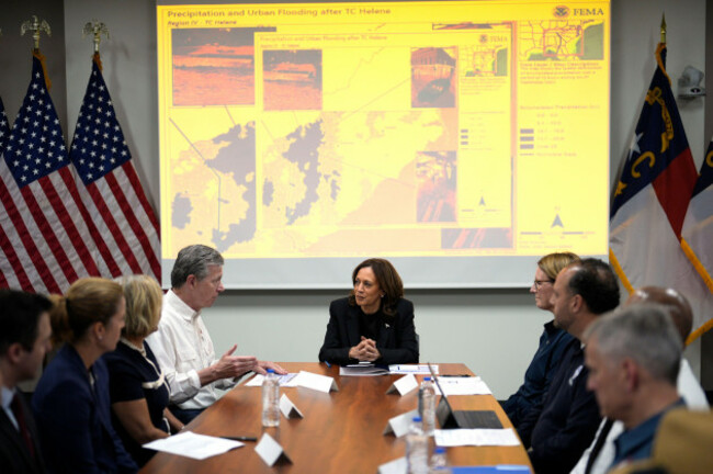 democratic-presidential-nominee-vice-president-kamala-harris-center-right-receives-a-briefing-from-north-carolina-gov-roy-cooper-center-left-on-the-damage-from-hurricane-helene-saturday-october