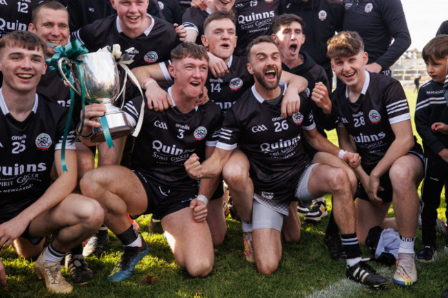 ryan-mcevoy-conor-laverty-and-cormac-oreilly-celebrate-with-the-trophy-after-the-game