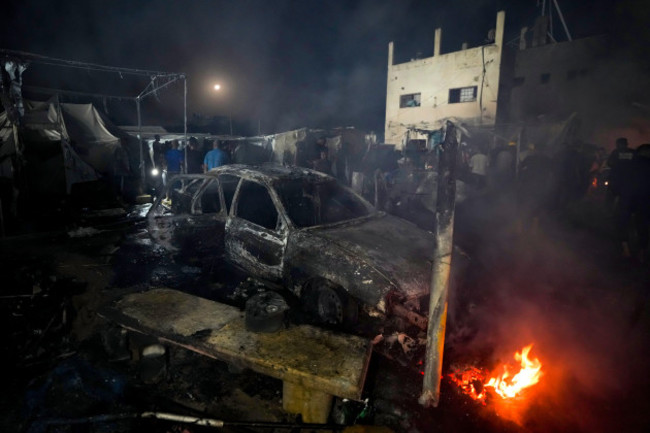 palestinians-inspect-the-damage-at-a-tent-area-in-the-courtyard-of-al-aqsa-martyrs-hospital-hit-by-an-israeli-bombardment-on-deir-al-balah-central-gaza-strip-monday-oct-14-2024-ap-photoabdel