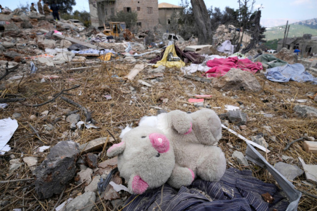 a-teddy-bear-lies-on-the-rubble-of-a-destroyed-building-at-the-site-of-mondays-israeli-airstrike-in-aito-village-north-lebanon-tuesday-oct-15-2024-ap-photohussein-malla