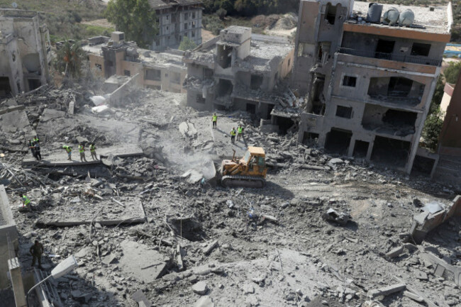 rescue-workers-use-a-bulldozer-to-remove-rubble-of-destroyed-buildings-hit-by-israeli-airstrikes-in-qana-village-south-lebanon-wednesday-oct-16-2024-ap-photomohammed-zaatari