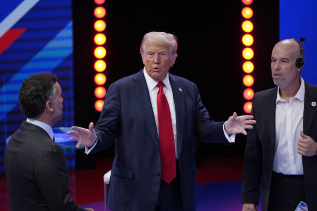 republican-presidential-nominee-former-president-donald-trump-speaks-with-televisas-enrique-acevedo-left-during-a-break-in-a-univision-town-hall-wednesday-oct-16-2024-in-doral-fla-ap-photo