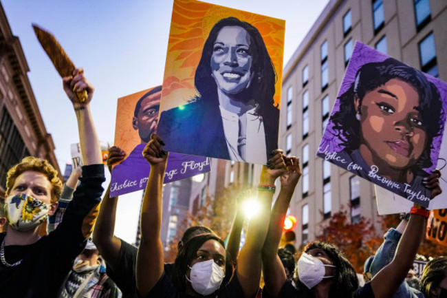 a-supporter-holds-a-poster-of-vice-president-elect-kamala-harris-as-they-celebrate-after-the-2020-presidential-election-is-called-for-president-elect-joe-biden-saturday-nov-7-2020-in-philadelphia