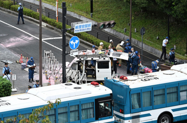 police-officers-investigate-a-vehicle-believed-to-have-crashed-into-the-prime-ministers-office-in-chiyoda-ward-tokyo-on-october-19-2024-according-to-the-tokyo-metropolitan-police-just-before-6-a