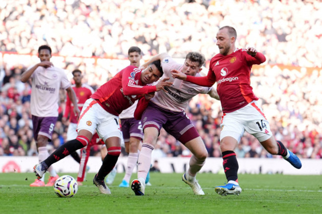 brentfords-nathan-collins-centre-battles-with-manchester-uniteds-casemiro-left-and-christian-eriksen-during-the-premier-league-match-at-old-trafford-manchester-picture-date-saturday-october-1