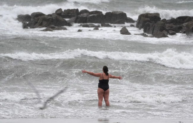 a-person-on-the-beach-in-salthill-galway-as-a-met-eireann-orange-alert-for-kerry-leitrim-sligo-clare-donegal-mayo-and-galway-came-into-effect-at-10am-on-sunday-and-will-be-in-place-to-8pm-as-st