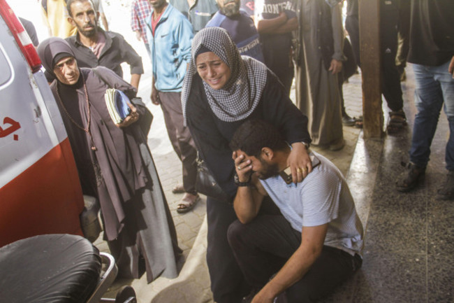 october-21-2024-gaza-city-the-gaza-strip-palestine-palestinians-mourn-their-relatives-who-were-killed-in-an-israeli-air-strike-on-jabalia-as-they-are-transported-to-al-mamdani-hospital-for-treatm