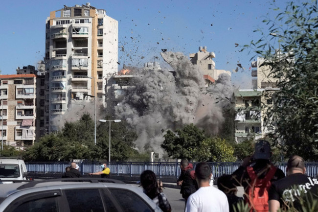 people-watch-a-building-collapse-after-being-hit-by-an-israeli-airstrike-in-ghobeiri-beirut-lebanon-tuesday-oct-22-2024-ap-photobilal-hussein