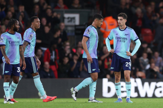 arsenals-william-saliba-centre-right-leaves-the-pitch-after-being-shown-a-red-card-during-the-premier-league-match-at-the-vitality-stadium-bournemouth-picture-date-saturday-october-19-2024