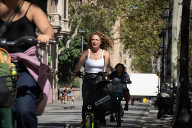 two-people-ride-electric-bicycles-on-september-13-2024-in-barcelona-catalonia-spain-the-president-of-the-government-announced-yesterday-40-million-in-state-aid-to-promote-cycling-of-which-20-mi