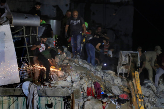 rescue-workers-search-for-victims-at-a-destroyed-building-hit-in-an-israeli-airstrike-in-the-southern-port-city-of-sidon-lebanon-tuesday-oct-29-2024-ap-photomohammed-zaatari