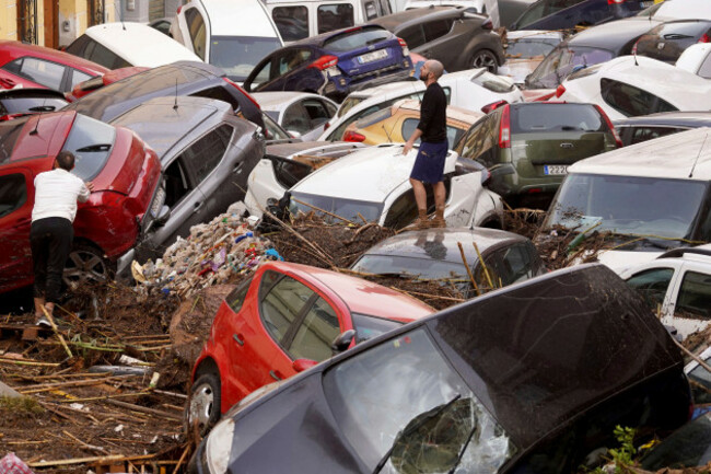 residents-look-at-cars-piled-up-after-being-swept-away-by-floods-in-valencia-spain-wednesday-oct-30-2024-ap-photoalberto-saiz