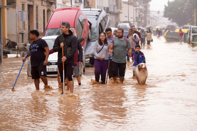 people-walk-through-flooded-streets-in-valencia-spain-wednesday-oct-30-2024-ap-photoalberto-saiz