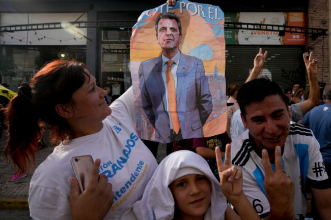 a-supporter-of-sergio-massa-argentine-economy-minister-and-presidential-candidate-for-the-ruling-party-holds-a-poster-with-his-image-in-ezeiza-buenos-aires-province-argentina-wednesday-nov-15