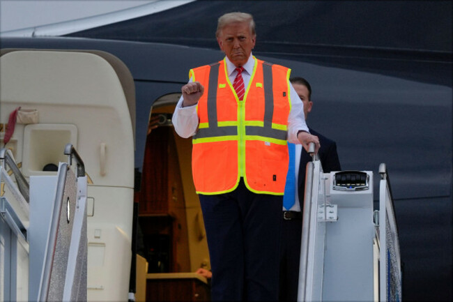 republican-presidential-nominee-former-president-donald-trump-wears-a-safety-vest-as-he-arrives-at-green-bay-austin-straubel-international-airport-wednesday-oct-30-2024-in-green-bay-wis-ap-pho