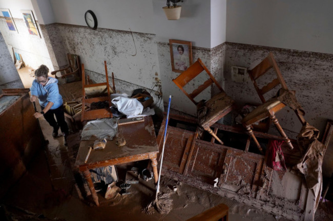 a-woman-cleans-her-house-affected-by-floods-in-valencia-spain-thursday-oct-31-2024-ap-photoalberto-saiz