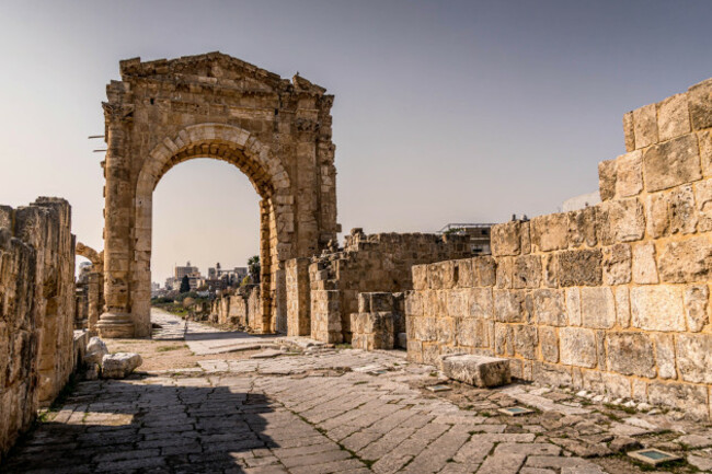 arch-of-adrian-the-roman-architecture-gate-at-tyre-al-bass-world-heritage-site-in-tyre-southern-lebanon-with-old-ancient-columns-and-paved-road