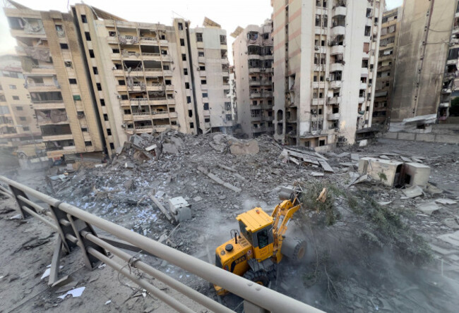 a-municipality-worker-uses-a-bulldozer-to-remove-the-rubble-of-a-destroyed-building-that-was-hit-in-an-israeli-airstrike-on-dahiyeh-in-the-southern-suburb-of-beirut-lebanon-friday-nov-1-2024-a