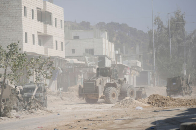 an-israeli-army-bulldozer-operates-at-the-parameter-of-the-nur-shams-refugee-camp-during-the-ongoing-army-operation-after-the-palestinian-health-ministry-said-two-palestinians-were-killed-in-an-israe