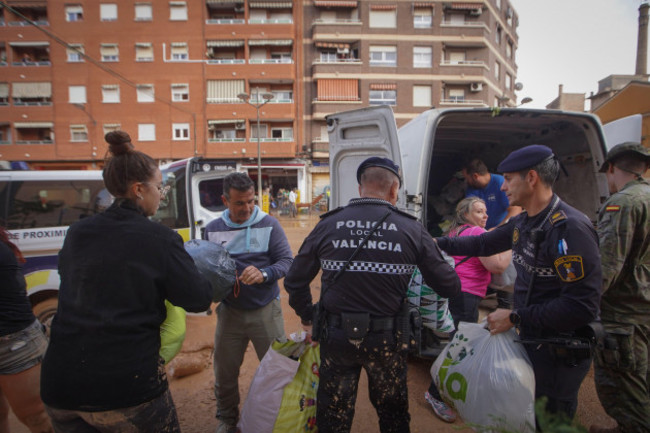 residents-volunteers-and-police-download-aid-for-flood-victims-at-an-assistance-point-in-the-parrish-of-the-la-torre-neighbourhood-of-valencia-spain-friday-nov-1-2024-ap-photoalberto-saiz