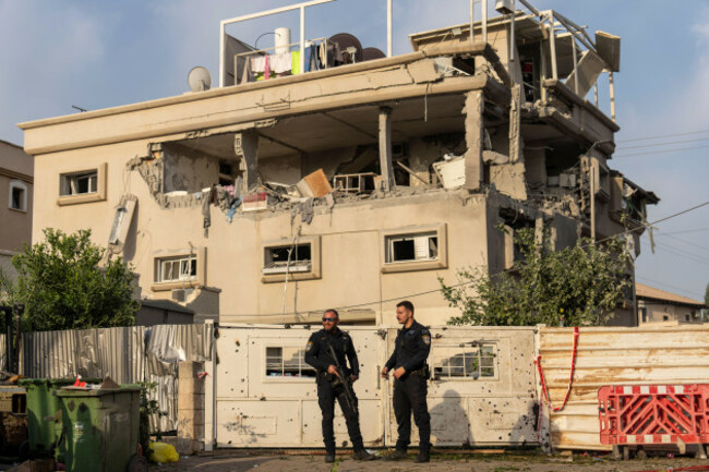 israeli-police-men-work-at-the-site-where-projectiles-fired-from-lebanon-hit-a-home-in-tira-central-israel-saturday-nov-2-2024-ap-photoariel-schalit