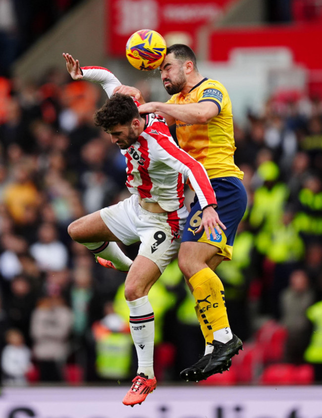 stoke-citys-tom-cannon-left-and-derby-countys-eiran-cashin-battle-for-the-ball-during-the-sky-bet-championship-match-at-the-bet365-stadium-stoke-picture-date-saturday-november-2-2024