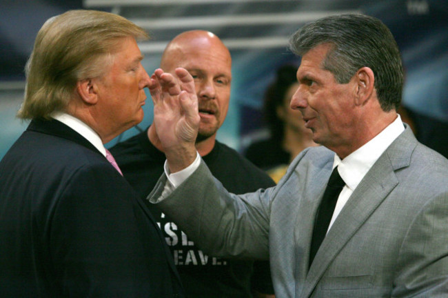 wrestler-stone-cold-steve-austin-center-watches-closely-as-vince-mcmahon-right-world-wrestling-entertainment-president-pushes-on-the-nose-of-donald-trump-real-estate-magnate-and-star-of-the-real