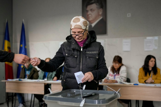 a-woman-prepares-to-cast-her-vote-during-a-presidential-election-runoff-in-chisinau-moldova-sunday-nov-3-2024-ap-photovadim-ghirda