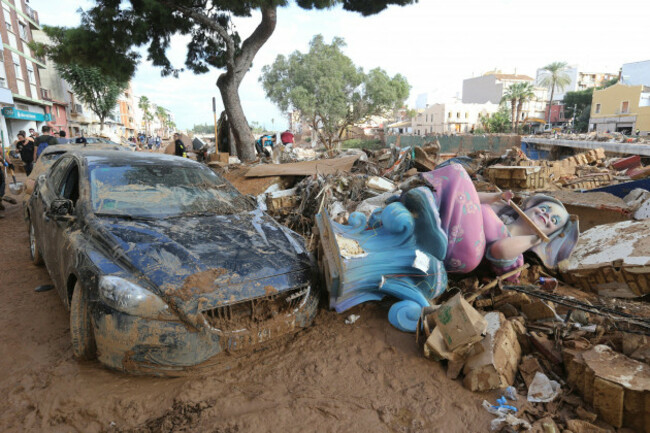 a-damaged-car-and-debris-lie-in-the-mud-after-floods-in-paiporta-near-valencia-spain-sunday-nov-3-2024-ap-photohugo-torres