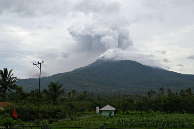 240117-east-nusa-tenggara-jan-17-2024-xinhua-this-photo-provided-by-indonesias-center-for-volcanology-and-geological-hazard-mitigation-pvmbg-shows-the-lewotobi-laki-laki-volcano-spewin