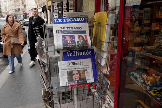 people-walk-past-a-newsstand-with-newspapers-headlining-on-the-us-election-tuesday-nov-5-2024-in-paris-ap-photomichel-euler