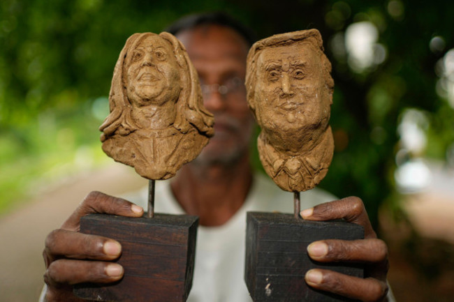 artist-upali-dias-holds-two-sculptures-of-us-vice-president-kamala-harris-and-former-us-president-donald-trump-in-colombo-sri-lanka-tuesday-nov-5-2024-ap-photoeranga-jayawardena