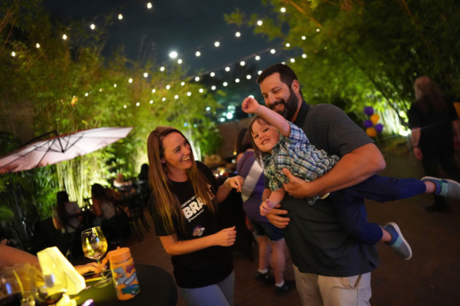 nurse-thea-thompson-37-left-and-her-husband-mark-shedlock-wrangle-their-2-year-old-xavier-as-they-join-other-supporters-of-floridas-amendment-4-which-would-enshrine-abortion-rights-in-the-state