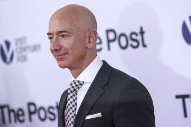 jeff-bezos-poses-as-he-arrives-on-the-red-carpet-for-the-post-premier-at-the-newseum-on-december-14-2017-in-washington-dc-photo-by-oliver-contrerassipa-usa